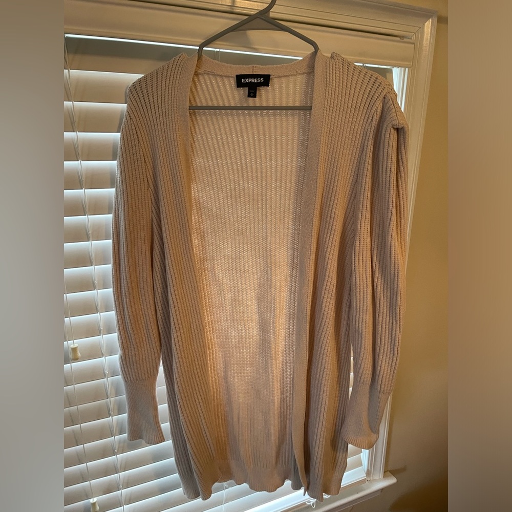 Express cardigan. Peach in color. Size Medium. Excellent condition.